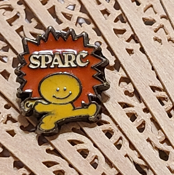 Vintage Other - SPARC Collectible Pin with Orange and Yellow Design